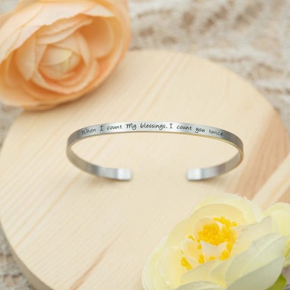 Stainless steel cuff bracelet with engraved words 'When I count my blessings, I count you twice'—a heartfelt expression of love and gratitude for your loved ones.