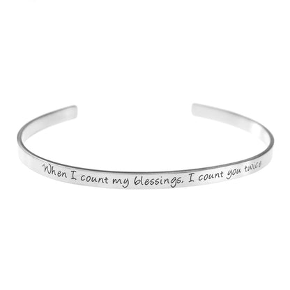 Stainless steel cuff bracelet with engraved words 'When I count my blessings, I count you twice'—a heartfelt expression of love and gratitude for your loved ones.