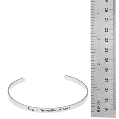 Stainless steel cuff bracelet with the inscription 'Dog, Unconditional Love' surrounded by paw prints.