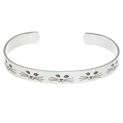 Stainless steel cuff bracelet with minimalist cat face and whiskers design, featuring the inscription 'Cat lady' on the inside.