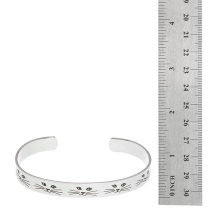 Stainless steel cuff bracelet with minimalist cat face and whiskers design, featuring the inscription 'Cat lady' on the inside.