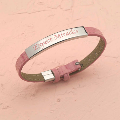 Pink Leather Strap Bracelet With "Expect Miracles" Engraved Plaque and Ribbon Charm