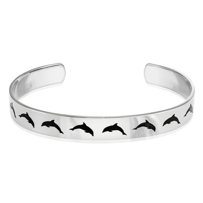 Stainless steel cuff bracelet with a minimalist dolphin jumping silhouette, featuring the inscription 'Peace' on the inside.