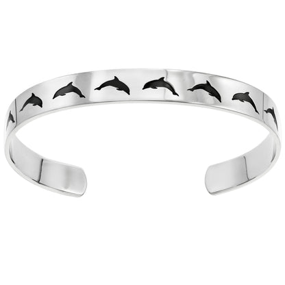 Stainless steel cuff bracelet with a minimalist dolphin jumping silhouette, featuring the inscription 'Peace' on the inside.