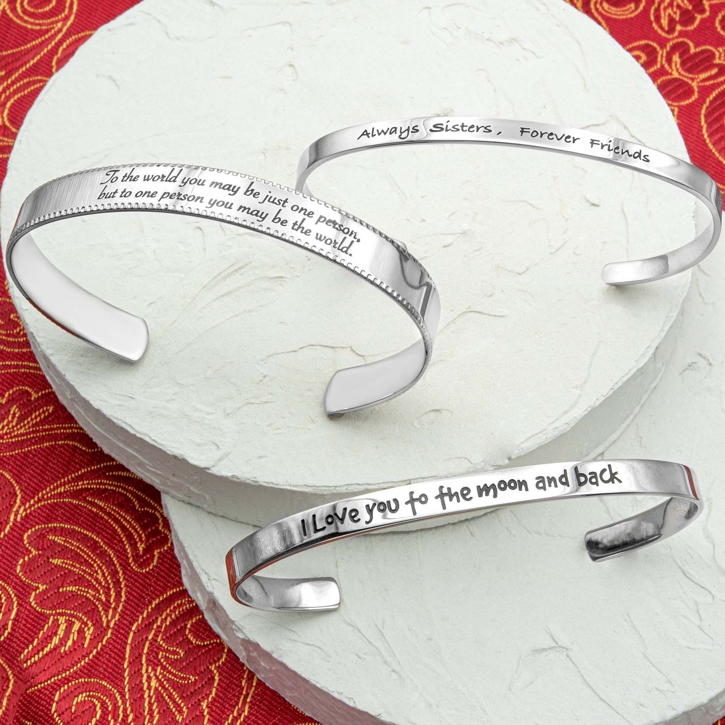 Stainless steel cuff bracelet with engraved words 'To the world you may be just one person, but to one person you may be the world'—a symbol of love and significance. Adjustable and crafted with high-quality materials.