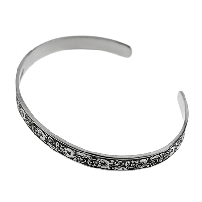 Inspirational stainless steel cuff bracelet with an elegant Victorian flower design on the outside and engraved words 'My maid of honor today, my sister forever' on the inside. Adjustable and hypoallergenic, perfect as a thoughtful gift for sisters and symbolizing the enduring bond of sisterhood.